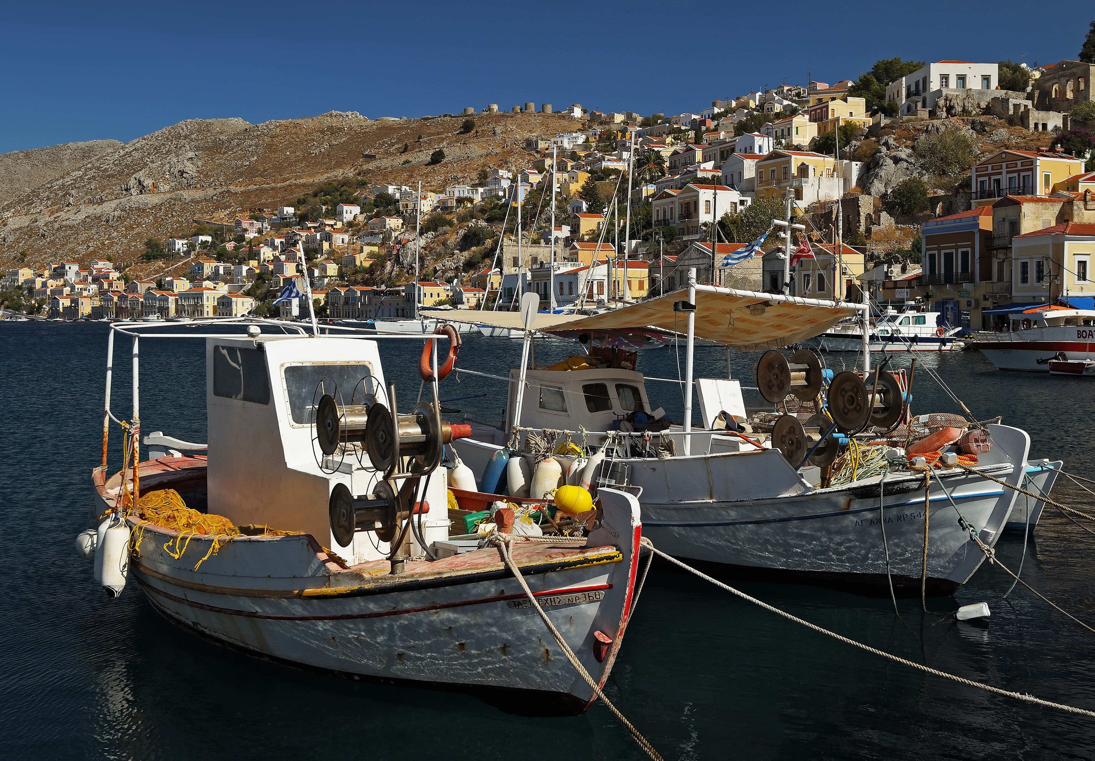 Small fishing boats moored in Ano Symi harbor, Greece -- the Mediterranean shore Catullus sailed home from