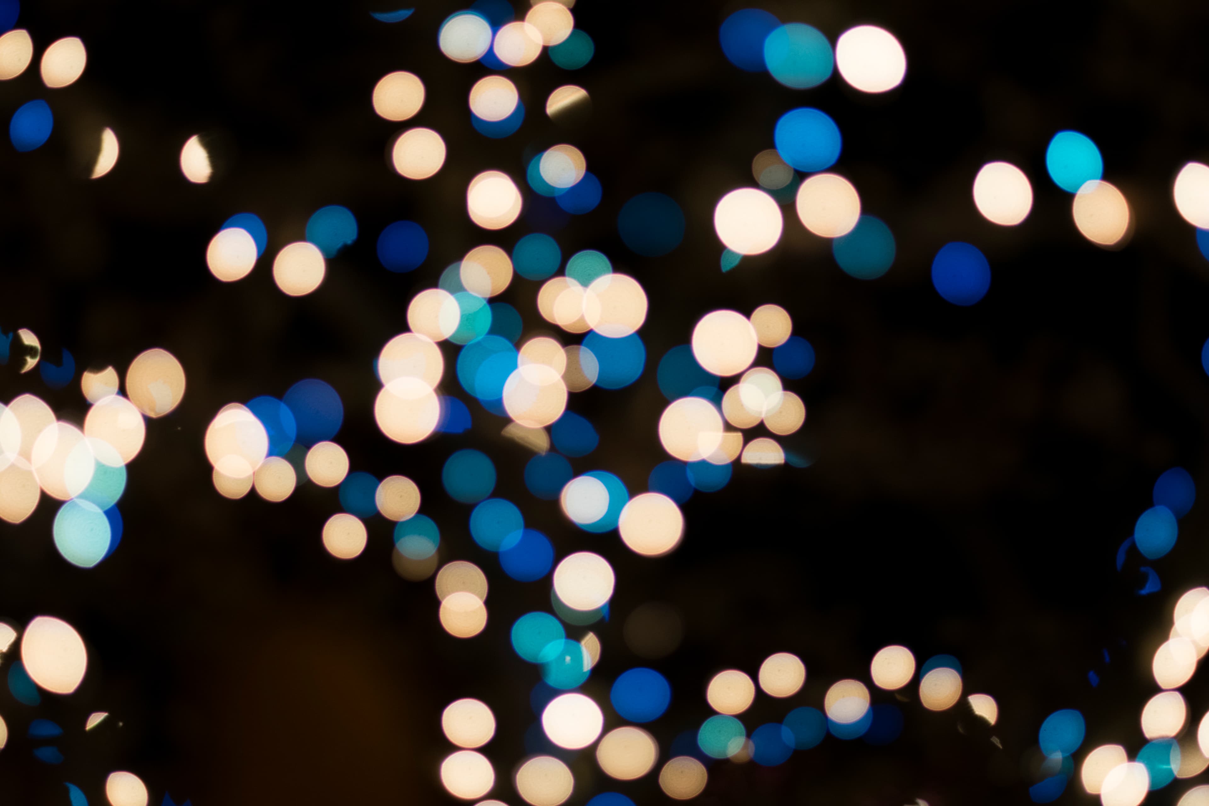 Golden bokeh lights blurring into warm yellow, the visual feeling of yellow cocktail music
